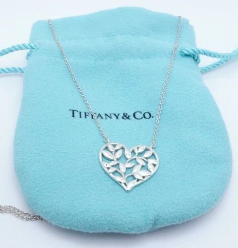 TIFFANY & CO. PALOMA PICASSO STERLING SILVER OLIVE LEAF HEART NECKLACE - 17.75": Tiffany & Co. Sterling Silver Paloma Picasso Olive Leaf Heart Pendant Necklace Length - 17.75" Long Pendant Size - 18mm Wide Total Weight - 2.4 Grams Retail - $250 USD Professionally Polished & Looks 