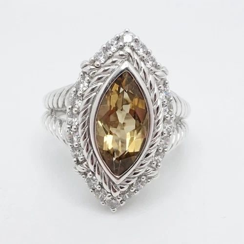 JUDITH RIPKA STERLING SILVER MARQUISE CITRINE &CLEAR CZ COCKTAIL RING 9.25: Judith Ripka Sterling Silver Marquise Citrine Clear Cubic Zirconia Split Shank Halo Ring Size - 9.25 Band Width - 3mm Height - 25mm Width - 15mm Gemstone Size - 16.5mm x 8.5mm Total Weight - 10 Grams 