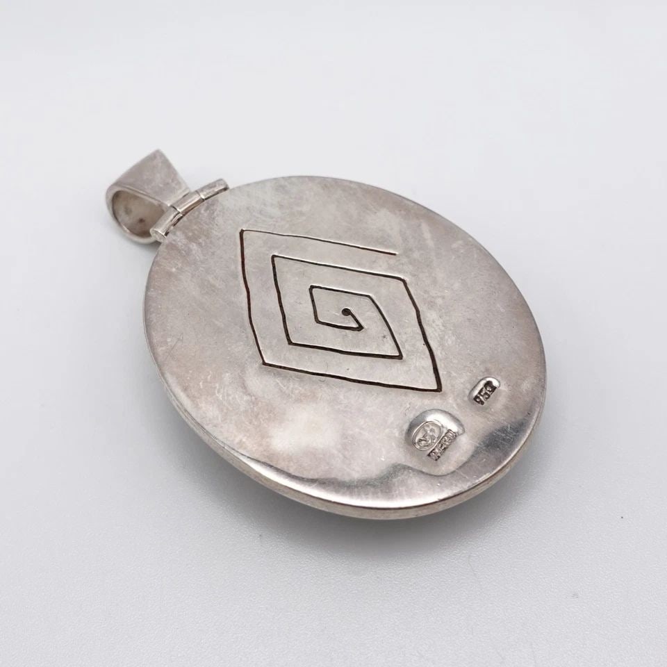 SILVER 950 PERU MULTI GEMSTONE INLAY OVAL PENDANT - 2.25": SILVER 950 PERU MULTI GEMSTONE INLAY OVAL PENDANT - 2.25" Silver 950 Peru Multi Gemstone Inlay Oval Pendant Height - 2.25" Length - 1.40" Bail Height - 8mm Bail Width - 6.5mm Total Weight - 32.3 Grams
