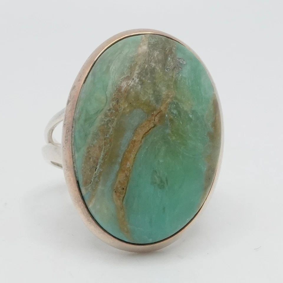 STERLING SILVER GREEN TURQUOISE CABOCHON SPLIT SHANK RING SIZE 11.75: STERLING SILVER GREEN TURQUOISE CABOCHON SPLIT SHANK RING SIZE 11.75 Sterling Silver Green Turquoise Cabochon Split Shank Ring Size - 11.75 Band Width - 3.5mm Stone Size - 25 x 18mm Total Weight - 8.1