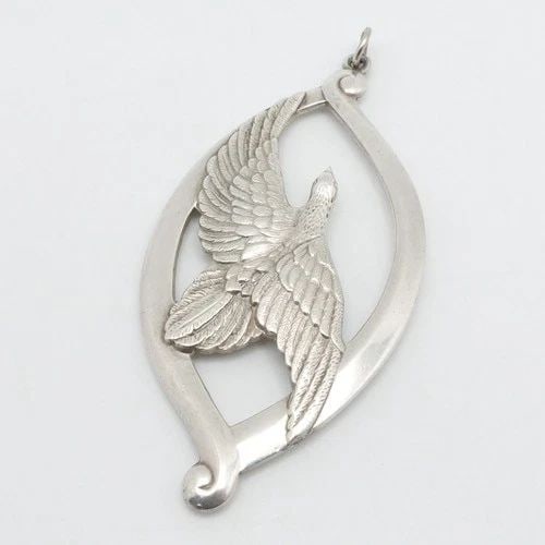WALLACE STERLING SILVER DOVE ORNAMENT PEACE ON EARTH LARGE PENDANT 3.25": WALLACE STERLING SILVER DOVE ORNAMENT PEACE ON EARTH LARGE PENDANT 3.25" Wallace Sterling Silver Peace On Earth Dove Ornament Large Pendant Length - 3.25" Width - 1.57" Bail Height - 3mm Total Weight 
