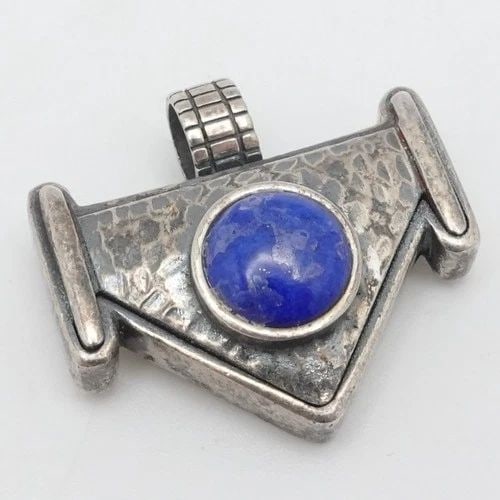 STERLING SILVER ROUND LAPIS LAZULI HAMMERED PENDANT 1": STERLING SILVER ROUND LAPIS LAZULI HAMMERED PENDANT 1" Sterling Silver Round Lapis Lazuli Hammered Pendant Total Length - 1" Bail Width - 5.5mm Gemstone Size - 9mm Total Weight - 13 Grams