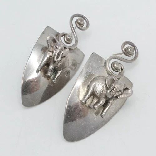 STERLING SILVER ELEPHANT ANIMAL MOTIF SHIELD SPIRAL DANGLE EARRINGS 2.25": STERLING SILVER ELEPHANT ANIMAL MOTIF SHIELD SPIRAL DANGLE EARRINGS 2.25" Sterling Silver Elephant Animal Shield Motif Spiral Dangle Earrings Length - 2.25" Width - 1" Total Weight - 22 Grams *No back