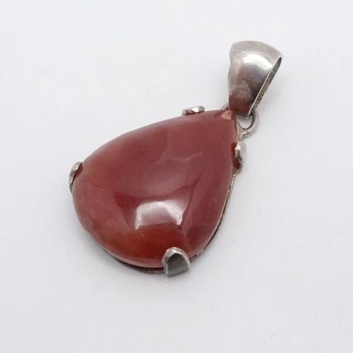 SILVER 950 ORANGE BROWN GEMSTONE TEARDROP PENDANT 1.5": SILVER 950 ORANGE BROWN GEMSTONE TEARDROP PENDANT 1.5" Silver 950 Orange Brown Teardrop Pendant Height - 1.5" Length - 0.75" Bail Height - 7.5mm Bail Width - 6mm Total Weight - 9.7 Grams
