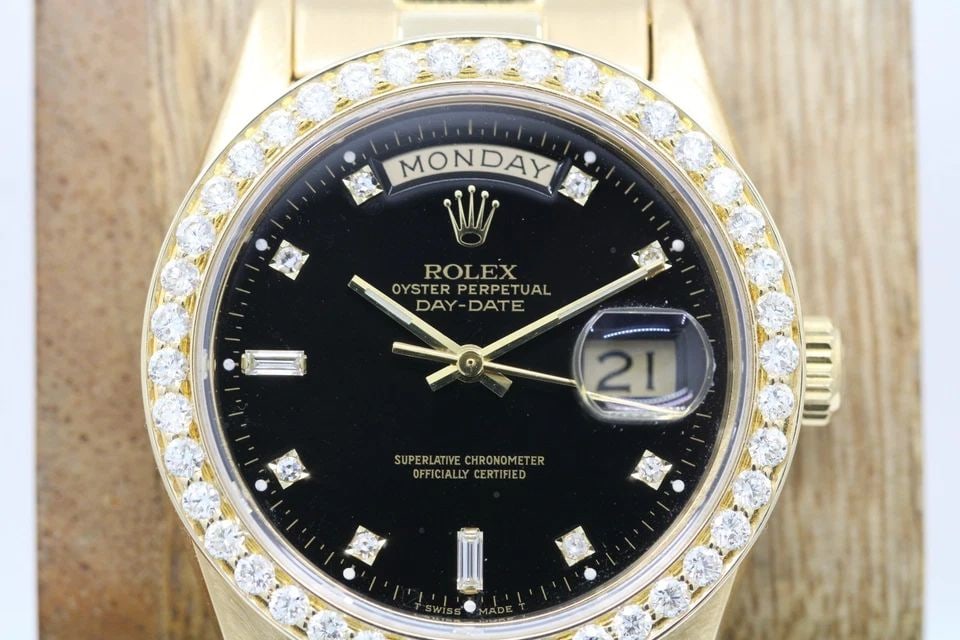 ROLEX PRESIDENT DAY-DATE 18K GOLD DIAMOND BEZEL 36MM BLACK DIAL WATCH 18038: ROLEX PRESIDENT DAY-DATE DIAMOND BEZEL & MARKERS 36MM BLACK DIAL WATCH Description Rolex President Day-Date Diamond Bezel & Markers 36mm Black Dial Watch 18038 The watch has been used previously. The 