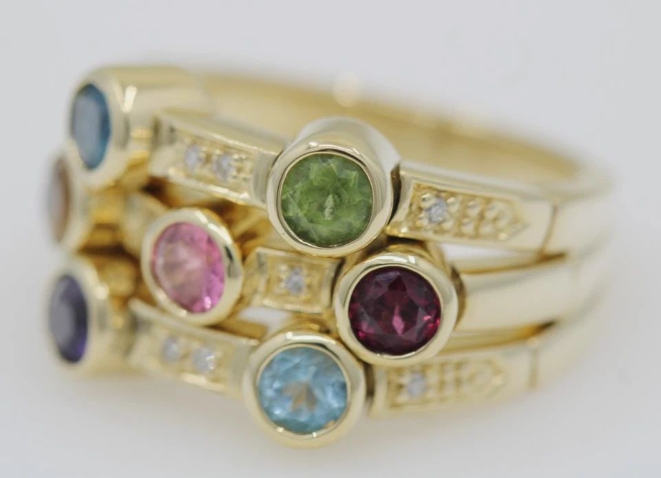 SONIA BITTON GALERIE DE BIJOUX 14K YELLOW GOLD MULTI GEMSTONE 3 ROW FLEX RING: SONIA BITTON GALERIE DE BIJOUX 14K YELLOW GOLD MULTI GEMSTONE 3 ROW FLEX RING Description Sonia Bitton Galerie de Bijoux 14K Yellow Gold Multi Gemstone 3 Row Flex Ring Ring is in great condition. May 