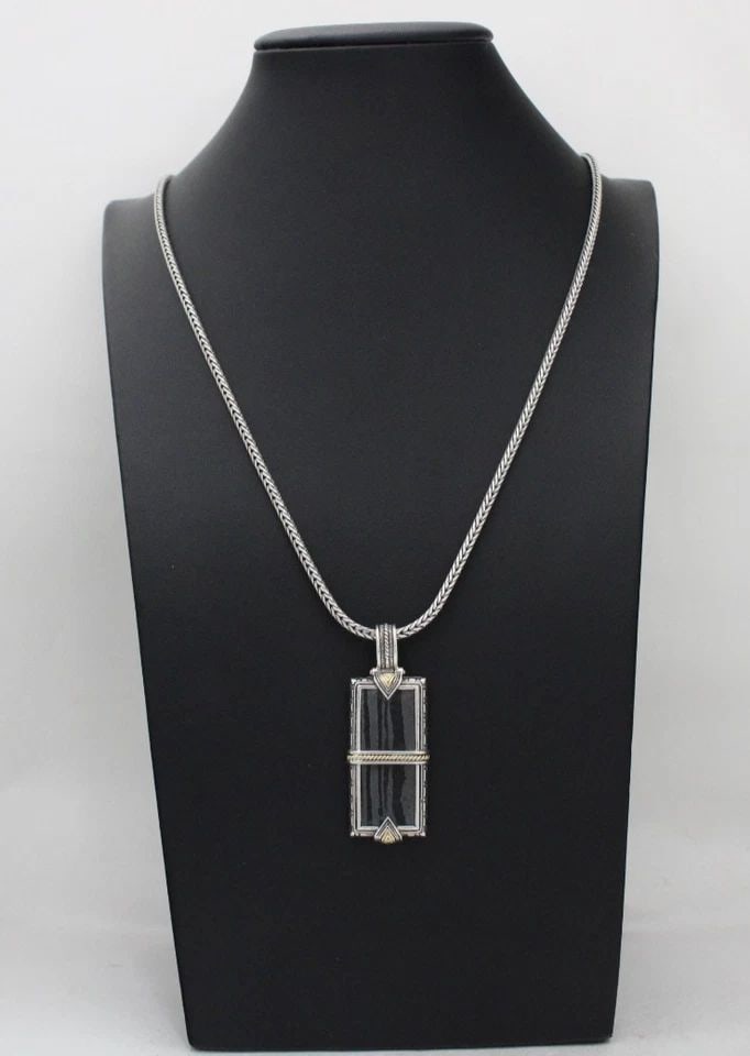 KONSTANTINO STERLING SILVER & 18K GOLD CARVED FERRITE PENDANT NECKLACE 26" W/BOX: KONSTANTINO STERLING SILVER & 18K GOLD CARVED FERRITE PENDANT NECKLACE 26" W/BOX Description Konstantino Sterling Silver & 18K Yellow Gold Carved Ferrite Pendant Necklace Pendant/necklace is in good c