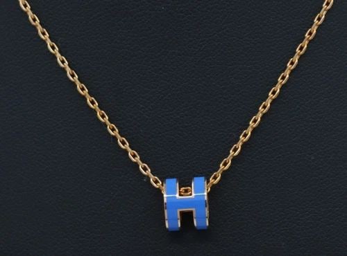 HERMES MINI POP H ROSE GOLD TONE & BLUE ENAMEL PENDANT NECKLACE 16": HERMES MINI POP H ROSE GOLD TONE & BLUE ENAMEL PENDANT NECKLACE 16" Description Hermes Mini Pop H Rose Gold Tone & Blue Enamel Pendant Necklace Pendant/necklace is in good condition. May show signs of