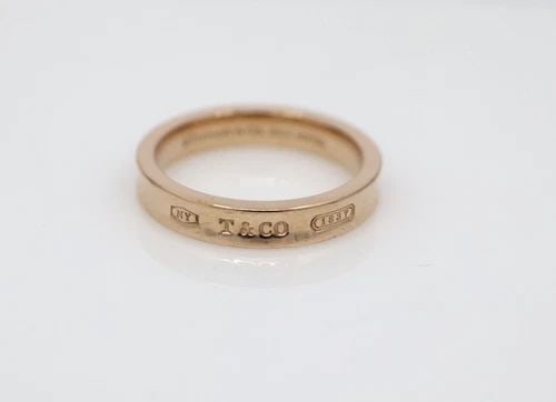 TIFFANY & CO. 1837 CONCAVE RUBEDO ROSE GOLD BAND RING SIZE 8: TIFFANY & CO. 1837 CONCAVE RUBEDO ROSE GOLD BAND RING SIZE 8 Description Tiffany & Co. 1837 Concave Rubedo Rose Gold Band Ring Item is in good condition. May show signs of wear and/or tear. Approximat