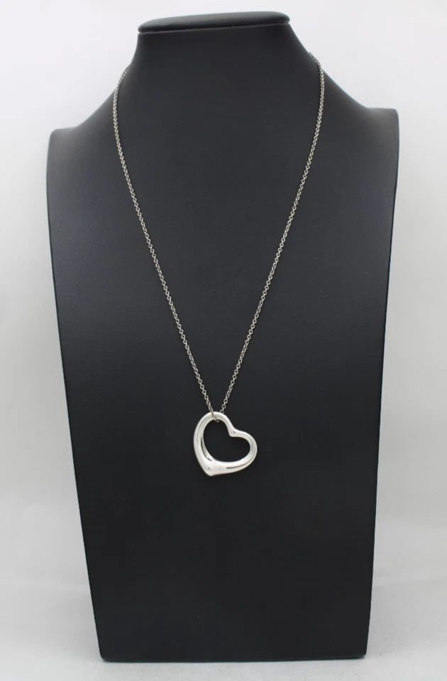 TIFFANY & CO ELSA PERETTI STERLING SILVER OPEN HEART PENDANT 19": TIFFANY & CO ELSA PERETTI STERLING SILVER OPEN HEART PENDANT 19" Description Tiffany & Co Elsa Peretti Sterling Silver Open Heart Pendant Pendant/necklace is in good condition. May show signs of wear 