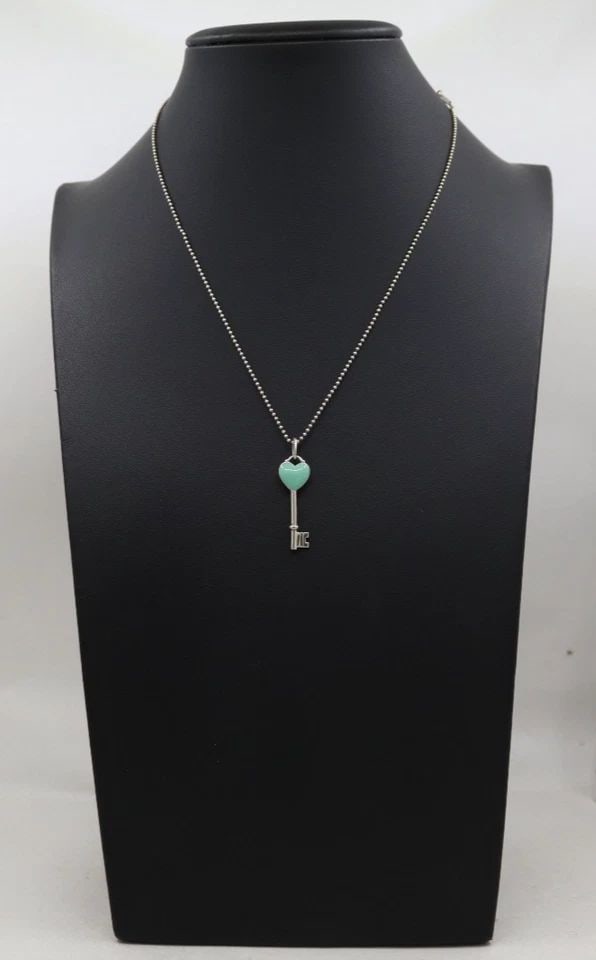 TIFFANY & CO STERLING BLUE ENAMEL HEART KEY CHARM PENDANT CHAIN W/ 16" NECKLACE: TIFFANY & CO STERLING BLUE ENAMEL HEART KEY CHARM PENDANT CHAIN W/ 16" NECKLACE Description Tiffany & Co Sterling Blue Enamel Heart Key Charm Pendant Chain w/ 16" Necklace Pendant/necklace is in good 