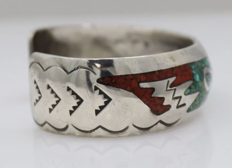 NAVAJO DELVIN NELSON STERLING SILVER TURQUOISE & CORAL INLAY CUFF BRACELET 6": NAVAJO DELVIN NELSON STERLING SILVER TURQUOISE & CORAL INLAY CUFF BRACELET 6" Description Navajo Delvin Nelson Sterling Silver Turquoise & Coral Inlay Cuff Bracelet Bracelet is in good condition. May 