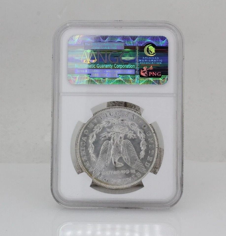 1904-O MORGAN SILVER DOLLAR $1 NGC MS63: 1904-O MORGAN SILVER DOLLAR $1 NGC MS63 Description 1904-O Morgan Silver Dollar $1 NGC MS63 Coin is in great condition. Plastic holder may show signs of wear and/or tear. The listing is for the coin o