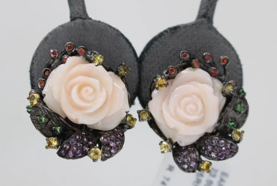STERLING SILVER & RHODIUM PLATED CORAL ROSE & SAPPHIRE EARRINGS: STERLING SILVER & RHODIUM PLATED CORAL ROSE & SAPPHIRE EARRINGS Description Sterling Silver & Rhodium Plated Coral Rose & Sapphire Earrings Earrings are in good condition. May show signs of wear and/o