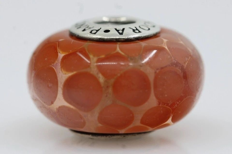 PANDORA RED EXOTIC XL MURANO GLASS CHARM 6.9 GRAMS: PANDORA RED EXOTIC XL MURANO GLASS CHARM 6.9 GRAMS Description Pandora Red Exotic XL Murano Glass Charm Pandora charm in good condition. May show signs of wear and/or tear. Approximate Measurements Le