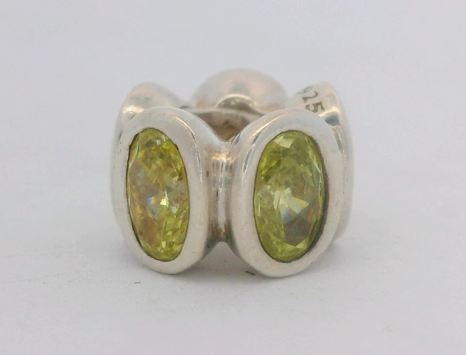 PANDORA STERLING SILVER MOMENTS LIME OVAL LIGHTS CHARM SPACER 790311LCZ: PANDORA STERLING SILVER MOMENTS LIME OVAL LIGHTS CHARM SPACER 790311LCZ Description Pandora Sterling Silver Moments Lime Oval Lights Charm Spacer 790311LCZ Item is in good condition. May show signs of