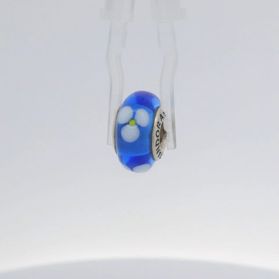 PANDORA STERLING SILVER MURANO BLUE AND WHITE FLOWER GLASS CHARM 790609: PANDORA STERLING SILVER MURANO BLUE AND WHITE FLOWER GLASS CHARM 790609 Description PANDORA Sterling Silver MURANO BLUE AND WHITE FLOWER Glass Charm 790609 Item is in good condition. May show signs of
