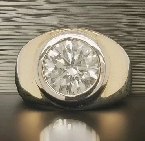 5.24CT. NATURAL ROUND CARAT DIAMOND STATEMENT UNISEX RING 14K YELLOW GOLD: 5.24CT. NATURAL ROUND CARAT DIAMOND STATEMENT UNISEX RING 14K YELLOW GOLD A bold and powerful statement piece crafted in solid 14K yellow gold, designed for the distinguished gentleman. At the center 