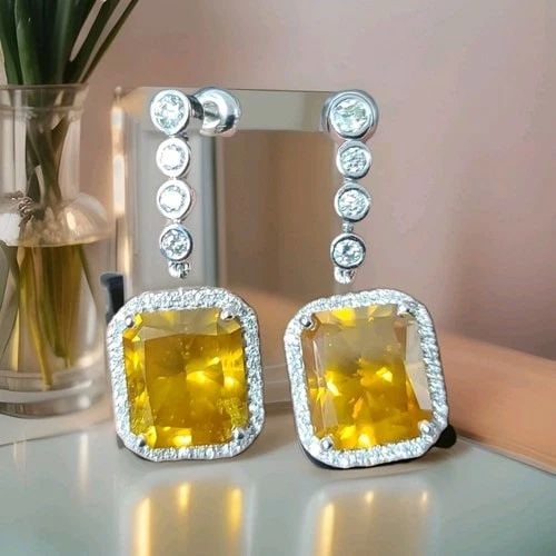 VINTAGE 14K WHITE GOLD DROP EARRINGS 15.54CT. NATURAL YELLOW DIAMOND RADIANT CUT: VINTAGE 14K WHITE GOLD DROP EARRINGS 15.54CT. NATURAL YELLOW DIAMOND RADIANT CUT Gorgeous 14K white gold drop earrings Natural treated yellow diamonds 15.54-carat total weight yellow diamonds. SI1 cla