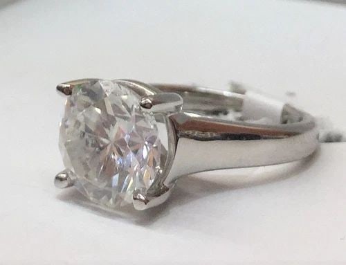 14K WHITE GOLD NATURAL ROUND DIAMOND RING 3.43CT I1-H: 14K WHITE GOLD NATURAL ROUND DIAMOND RING 3.43CT I1-H GORGEOUS 14k white gold diamond ring center round shape natural clarity enhanced diamond weight 3.43ct Size 9.1mm I1 - H COL0R very lively .NICE c