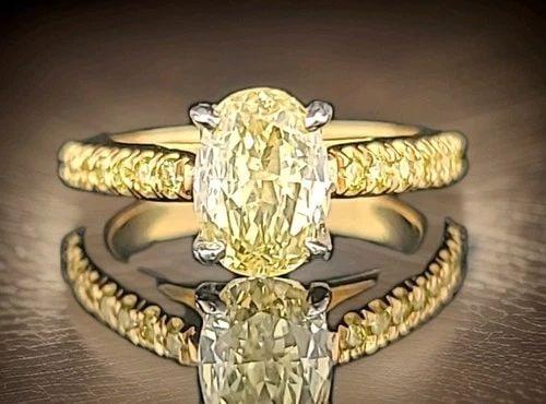 18K YELLOW GOLD ENGAGEMENT RING WITH 1.77CT NATURAL FANCY INTENSE YELLOW DIAMOND: 18K YELLOW GOLD ENGAGEMENT RING 1.77CT. NATURAL FANCY INTENSE YELLOW DIAMOND GORGEOUS 18K Yellow GOLD natural fancy intense yellow diamond in oval shape Center weight 1.77ct. size 8.6x6.2mm very nice 