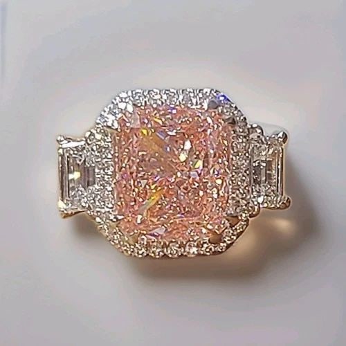 PLATINUM ENGAGEMENT RING 10.00CT LAB GROWN VIVID PINK DIAMOND CUSHION SHAPE IGI: PLATINUM ENGAGEMENT RING 10.00CT LAB GROWN VIVID PINK DIAMOND CUSHION SHAPE IGI This exceptional platinum engagement ring showcases a breathtaking 10.00-carat lab-grown cushion-cut pink diamond, IGI c