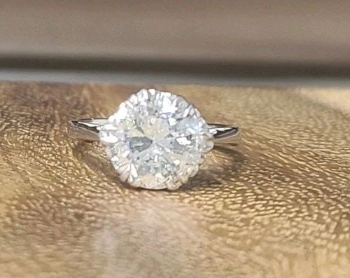 PLATINUM VINTAGE ENGAGEMENT RING 2.79CT. NATURAL ROUND DIAMOND CIRCA 1930'S: PLATINUM VINTAGE ENGAGEMENT RING 2.79CT. NATURAL ROUND DIAMOND CIRCA 1930'S Crafted in solid platinum, this exceptional Art Deco engagement ring dates back to the 1930s and embodies timeless antique e