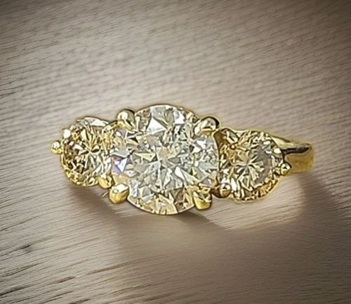 VINTAGE 14K YELLOW GOLD ENGAGEMENT RING 2.04CT.NATURAL EURO CUT ROUND DIAMOND: VINTAGE 14K YELLOW GOLD ENGAGEMENT RING 2.04CT.NATURAL EURO CUT ROUND DIAMOND Celebrate timeless elegance with this exceptional vintage 14K yellow gold three-stone engagement ring. At its center is a 