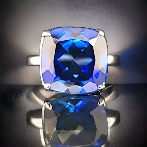 TIFFANY & CO 18K WHITE GOLD ENGAGEMENT RING 14.25CT. BLUE SAPPHIRE CUSHION CUT: TIFFANY & CO 18K WHITE GOLD ENGAGEMENT RING 14.25CT. BLUE SAPPHIRE CUSHION CUT This stunning ring from Tiffany & Co. is the perfect choice for any special occasion, whether it's for an engagement, bir