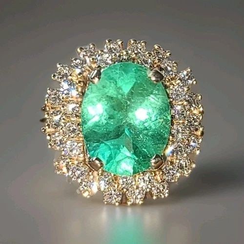 VINTAGE 14K YELLOW GOLD ENGAGEMENT RING 4.79CT.NATURAL COLOMBIA EMERALD GIA CERT: VINTAGE 14K YELLOW GOLD ENGAGEMENT RING 4.79CT.NATURAL COLOMBIA EMERALD GIA CERT This 14k Yellow Gold Engagement Ring features a stunning 4.79CT Natural Colombia Emerald in an Oval shape, with a GIA c