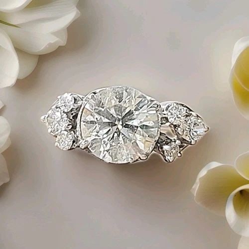VINTAGE 14K WHITE GOLD ENGAGEMENT RING 2.82CT. NATURAL ROUND DIAMOND CIRCA 1950S: VINTAGE 14K WHITE GOLD ENGAGEMENT RING 3.35CT. NATURAL EURO CUT ROUND DIAMOND This vintage 14k white gold engagement ring features a 3.35CT natural Euro cut round clarity enhanced diamond as the main 