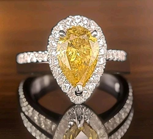14K YELLOW GOLD ENGAGEMENT RING 1.91CT. NATURAL PEAR CUT YELLOW DIAMOND GIA CERT: 14K YELLOW GOLD ENGAGEMENT RING 1.91CT. NATURAL PEAR CUT YELLOW DIAMOND GIA CERT This 14k Yellow Gold Engagement Ring features a stunning 1.91CT natural yellow pear-cut diamond certified by GIA. The r