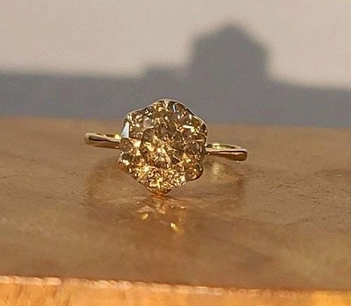 VINTAGE 14K YELLOW GOLD ENGAGEMENT RING 3.04CT. NATURAL ROUND CHAMPAGNE DIAMOND: VINTAGE 14K YELLOW GOLD ENGAGEMENT RING 3.04CT. NATURAL ROUND CHAMPAGNE DIAMOND This exquisite vintage 14k yellow gold engagement ring showcases a 3.04ct natural round champagne diamond (8.5mm) with I