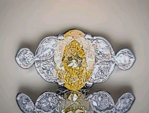 VINTAGE PLATINUM ENGAGEMENT RING 1.52CT.NATURAL YELLOW DIAMOND OVAL SHAPE: Vintage Platinum Engagement Ring 1.52CT.Natural Yellow Diamond Oval Shape This stunning vintage engagement ring is crafted in platinum and features a natural fancy oval yellow diamond weighing approxi