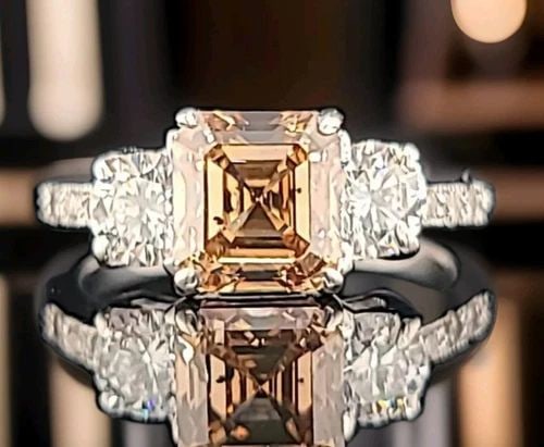 14K WHITE GOLD VINTAGE ENGAGEMENT RING 2.06CT. CHAMPAGNE DIAMOND ASSCHER CUT: 14K WHITE GOLD VINTAGE ENGAGEMENT RING 2.06CT. CHAMPAGNE DIAMOND ASSCHER CUT This beautiful vintage engagement ring is expertly crafted in solid 14K white gold and showcases a striking 2.06ct natural 