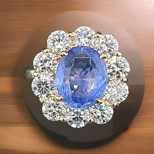 14K YELLOW GOLD ENGAGEMENT RING 3.79CT. NATURAL UNTREATED OVAL BLUE SAPPHIRE: 14K YELLOW GOLD ENGAGEMENT RING 3.79CT. NATURAL UNTREATED OVAL BLUE SAPPHIRE This stunning engagement ring is crafted from 14kt yellow gold and features a beautiful oval-shaped blue sapphire stone, wi