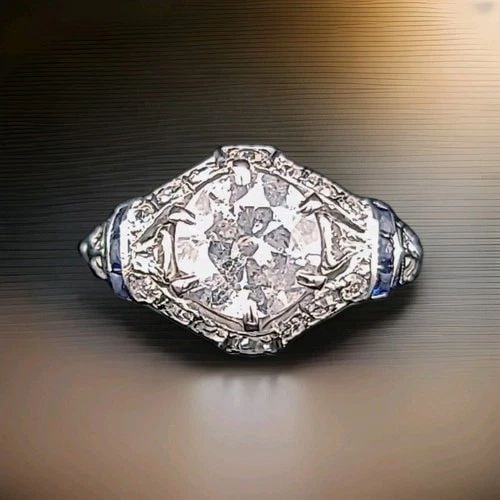 PLATINUM VINTAGE FILIGREE 1.50CT. NATURAL OLD EURO DIAMOND SAPPHIRE RING 1920'S: PLATINUM VINTAGE FILIGREE 1.50CT. NATURAL OLD EURO DIAMOND SAPPHIRE RING 1920'S A breathtaking original Art Deco platinum filigree ring from the 1920s, capturing the elegance of a timeless era. At its