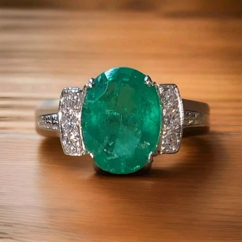 VINTAGE PLATINUM ENGAGEMENT RING 5.45CT. GEM NATURAL GREEN EMERALD OVAL SHAPE: VINTAGE PLATINUM ENGAGEMENT RING 5.45CT. GEM NATURAL GREEN EMERALD OVAL SHAPE This stunning vintage platinum engagement ring features a beautiful oval-shaped natural green emerald as the main stone, w