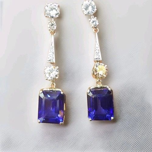 VINTAGE 18K WHITE GOLD DIFFUSED BLUE SAPPHIRE & DIAMOND EARRINGS – 6.20CT TOTAL: VINTAGE FILIGREE 18K WHITE GOLD BLUE SAPPHIRE DROPS EARRINGS EMERALD CUT Presenting a pair of Gorgeous vintage 18k white gold natural diffused blue sapphire Earring. two centers natural diffused blue 