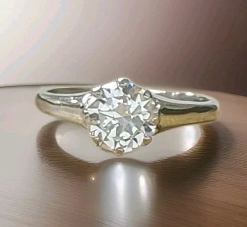 PLATINUM VINTAGE ENGAGEMENT RING 1.02CT. NATURAL ROUND CUT DIAMOND GIA CERT: Platinum Vintage Engagement Ring 1.02ct. Natural Round Cut Diamond GIA Cert A timeless 1940s vintage engagement ring, masterfully crafted in platinum and embodying the elegance . At its center rests a