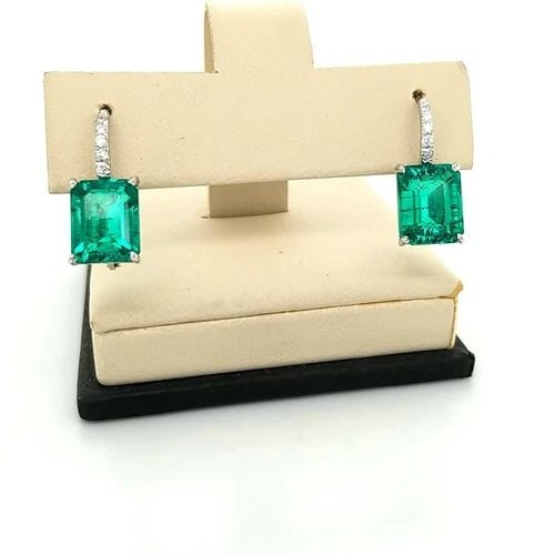 14K WHITE GOLD EMERALD EARRINGS 6.46CT EMERALD CUT WITH DIAMOND ACCENTS: 14K WHITE GOLD GREEN GEM EMERALD EARRINGS 6.46CT EMERALD SHAPE Gorgeous 14k white gold emerald earrings 6.46ct total weight lab growth green emerald in emerald shape, size 10x7.8mm clean, nice cut, ve