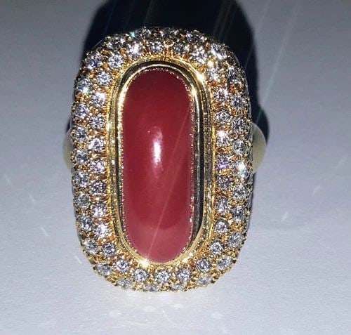 18K YELLOW GOLD NATURAL RED CORAL DIAMOND RING: 18K YELLOW GOLD NATURAL RED CORAL DIAMOND RING GORGEOUS 18K Yellow GOLD red coral shape weight 11.85ct. very nice rich red orange color nice luster very lively ,size 19.7mm x7.5mm side diamonds total 