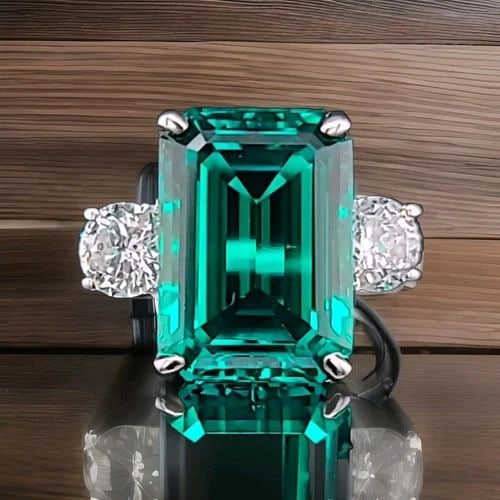VINTAGE 14K WHITE GOLD ENGAGEMENT RING 7.38CT. LAB-GROWN GEM GREEN EMERALD: VINTAGE 14K WHITE GOLD ENGAGEMENT RING 7.38CT.GEM GREEN EMERALD This vintage 14k white gold engagement ring is a stunning piece of fine jewelry that will capture everyone's attention. The ring feature