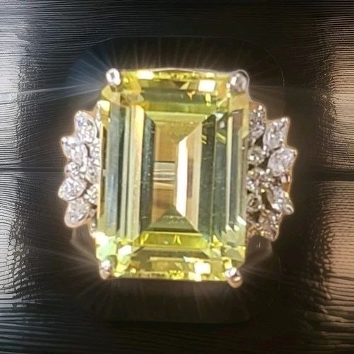 20.34 CT RECTANGULAR YELLOW SAPPHIRE VINTAGE PLATINUM RING WITH DIAMOND ACCENTS: 20.34 ct Rectangular Yellow Sapphire Vintage Platinum Ring with Diamond Accents This exquisite vintage platinum ring from the 1930s showcases a magnificent lab-grown yellow sapphire in an elegant emer