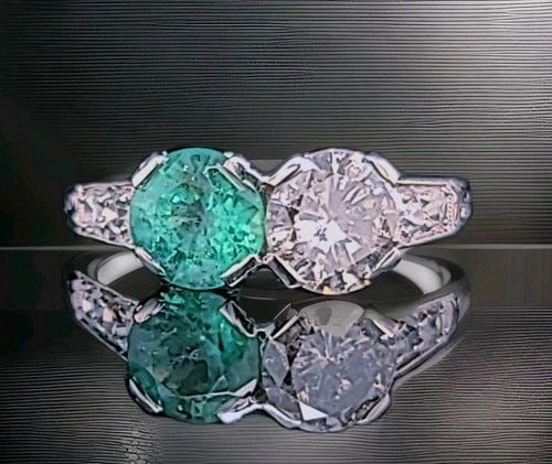 VINTAGE FILIGREE PLATINUM RING 1.73CT. NATURAL DIAMOND GREEN EMERALD CIRC 1930'S: VINTAGE FILIGREE PLATINUM RING 1.73CT. NATURAL DIAMOND GREEN EMERALD CIRC 1930'S This breathtaking vintage ring is masterfully crafted in luxurious platinum, showcasing a striking and timeless two-sto