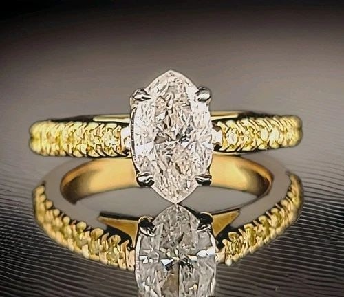 VINTAGE 18K YELLOW GOLD ENGAGEMENT RING 1.05CT. NATURAL MARQUISE DIAMOND: 18K YELLOW GOLD 1.05CT. NATURAL MARQUISE DIAMOND ENGAGEMENT RING Gorgeous natural marquise Diamond 18k yellow gold ring center natural marquise cut diamond weight 1.05ct size 9x5.3mm I1-H bright white