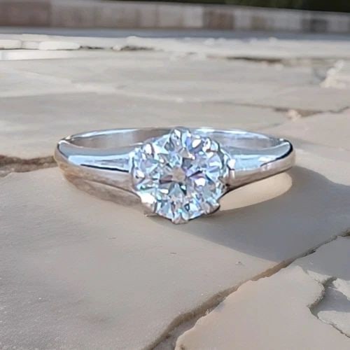PLATINUM VINTAGE ENGAGEMENT RING 1.05CT. LAB GROWN EURO-CUT DIAMOND: PLATINUM VINTAGE ENGAGEMENT RING 1.05CT. LAB GROWN EURO-CUT DIAMOND This vintage engagement ring is crafted in platinum and features a 1.05-carat lab-grown Euro-cut diamond. The ring is perfect for va