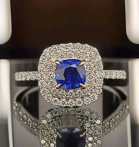 18K WHITE GOLD ENGAGEMENT RING 1.37CT. NATURAL SAPPHIRE CUSHION SHAPE: 18K WHITE GOLD ENGAGEMENT RING 1.37CT. NATURAL SAPPHIRE CUSHION SHAPE GORGEOUS 18K WHITE GOLD natural heated blue Sapphire cushion shape center weight 0.85ct. size 5mm very nice rich royal blue color 