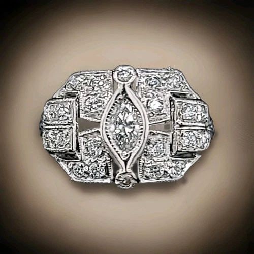 VINTAGE FILIGREE PLATINUM RING O.52CT. NATURAL MARQUISE DIAMOND CIRC 1930'S: 0.52CT VINTAGE FILIGREE PLATINUM RING NATURAL MARQUISE DIAMOND SI1-H This beautiful vintage ring is a timeless piece of jewelry that will make any occasion special. The ring features a stunning marqui