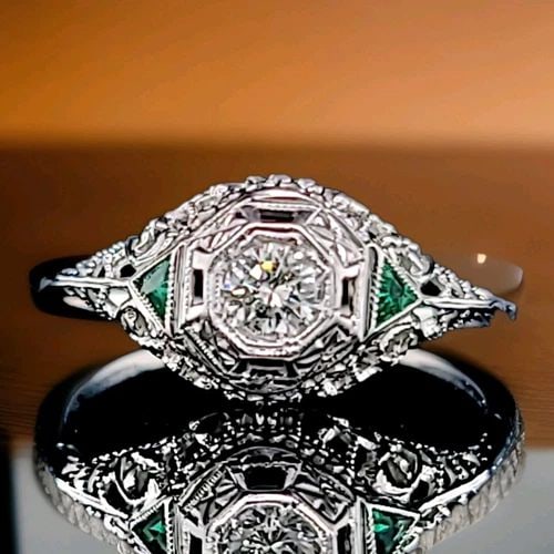 VINTAGE FILIGREE 18K WHITE GOLD ENGAGEMENT RING NATURAL ROUND DIAMOND 1920'S: VINTAGE FILIGREE 18K WHITE GOLD ENGAGEMENT RING NATURAL ROUND DIAMOND 1920'S This charming vintage Art Deco engagement ring, crafted in 18K white gold, features a natural round diamond weighing approx